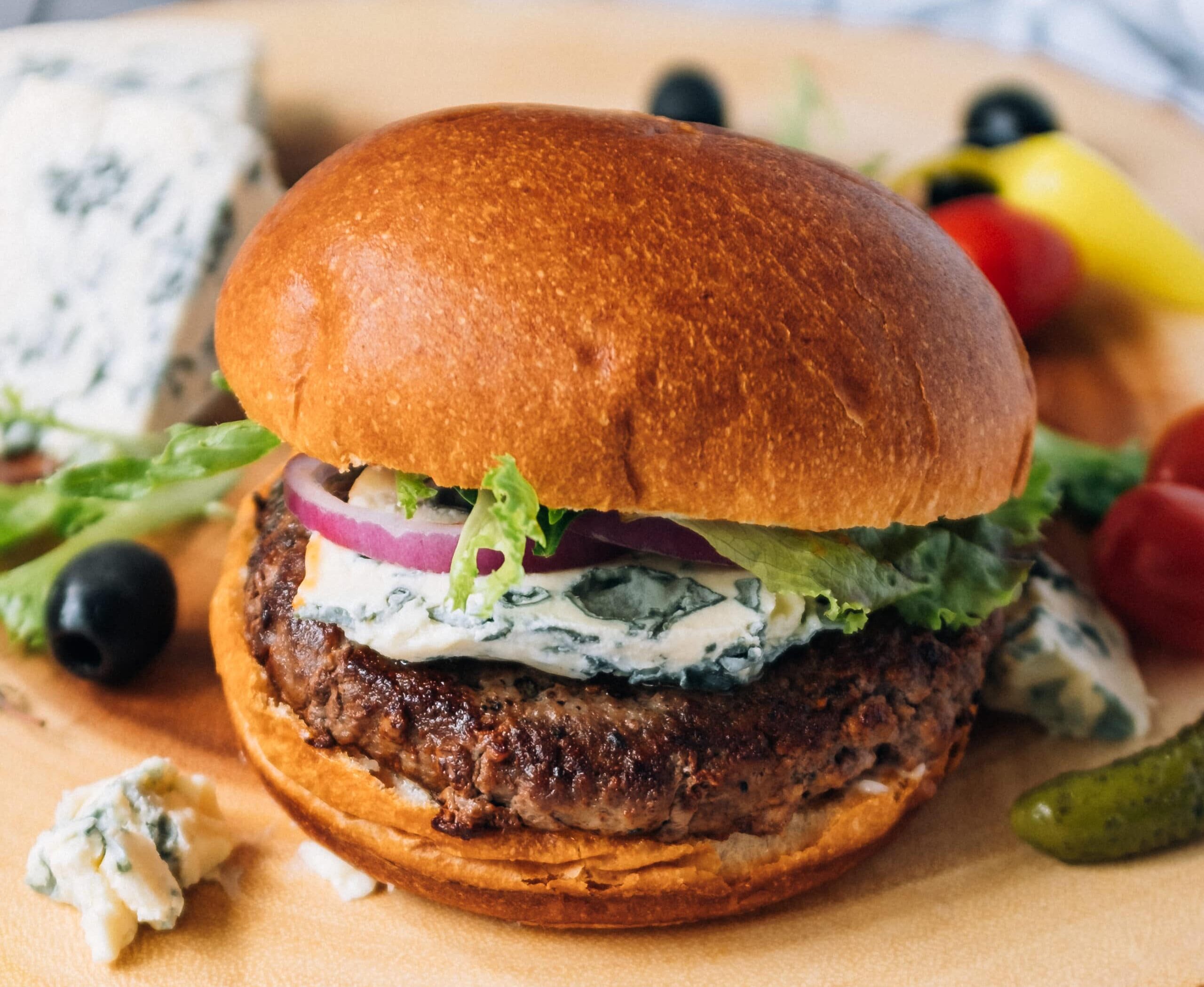 burger with melted saint agur blue cheese