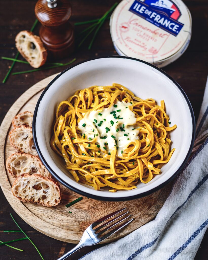 pasta dish with melted ile de france camembert