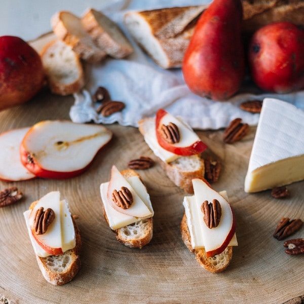 Ile de France brie on a slice of bread with some apple and pecan nut