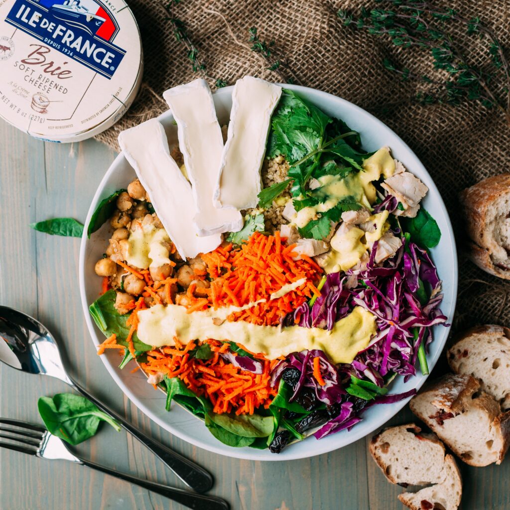 colorful salad bowl with vegetables and Ile de france brie