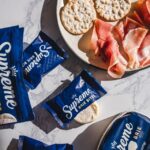 supreme brie bites with crackers and ham