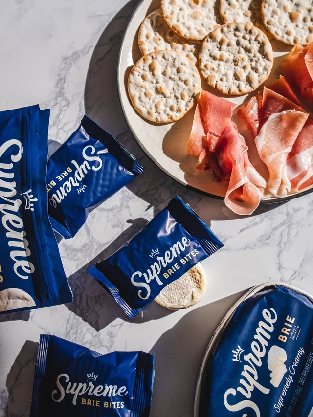 supreme brie bites with crackers and ham