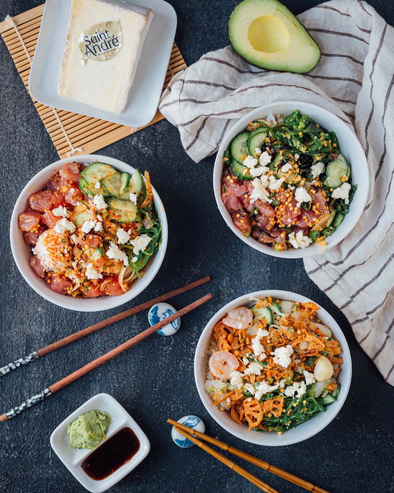 poke bowls with rice, salmon, shrimps, vegetables and saint andré cheese