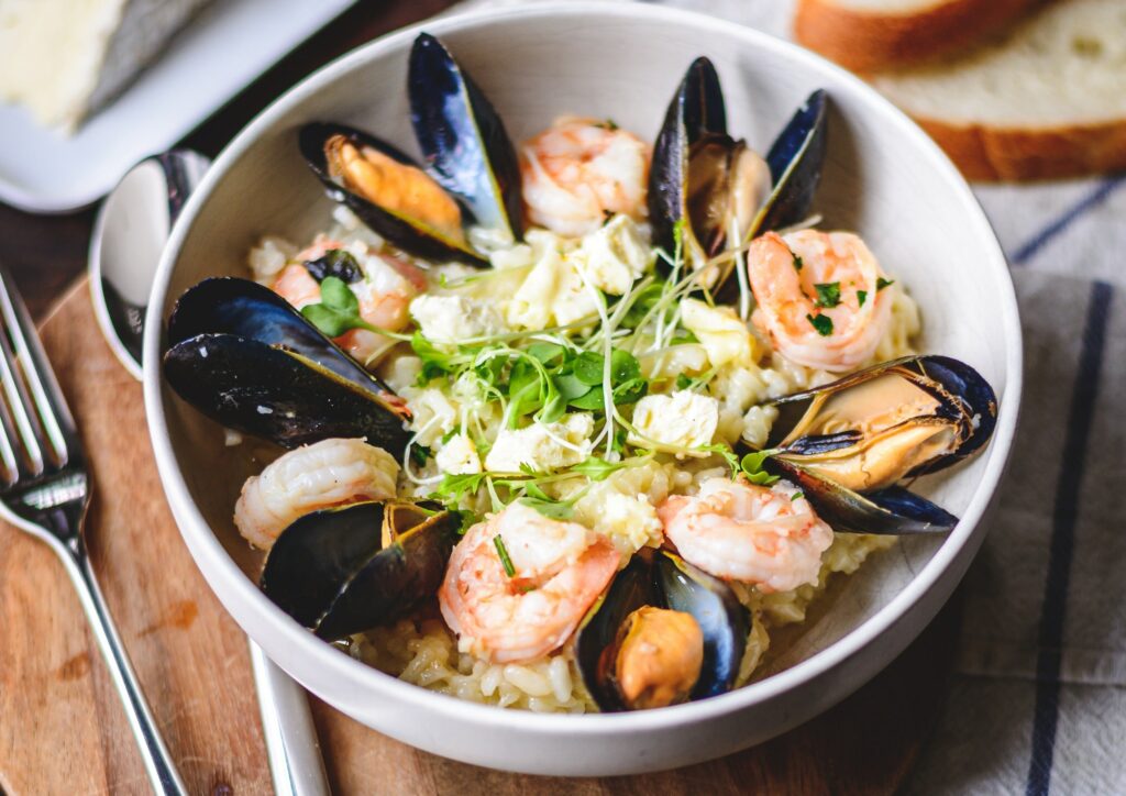 rice bowl with mussels, shrimps and saint andré cheese