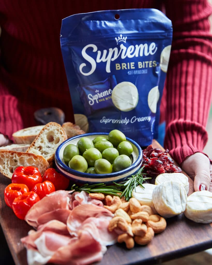 Platter of cheese with Supreme Brie Bites on it for a beautiful snack.